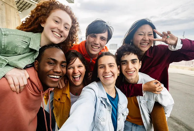 Group of friends taking a selfie together.